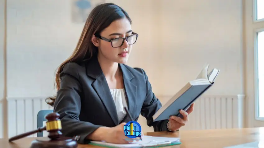 A person in a business suit is reading a book