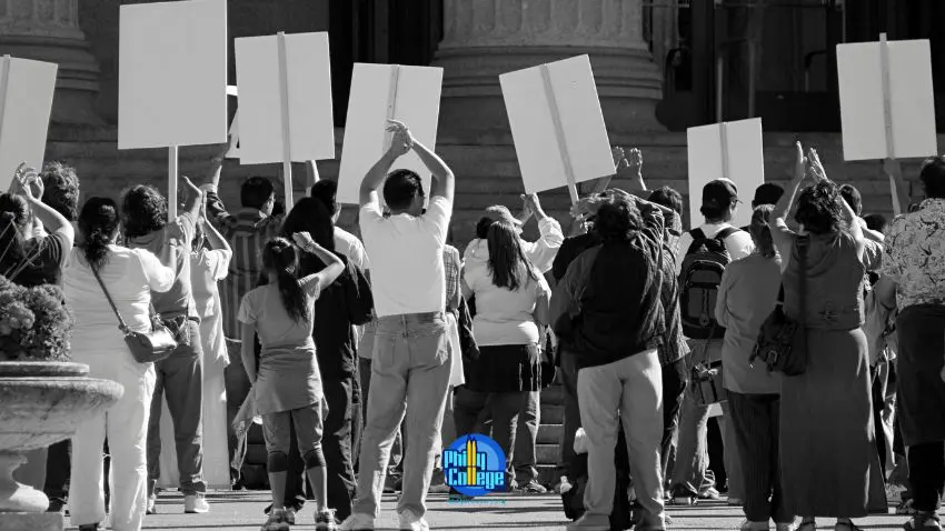 a black and white photo of a group of people holding up signs