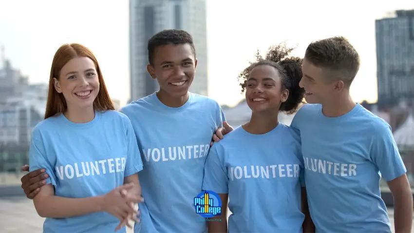 a group of people wearing volunteer t - shirts