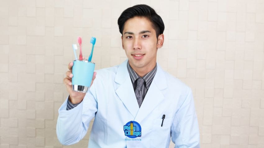 a person in a lab coat holding two toothbrushes