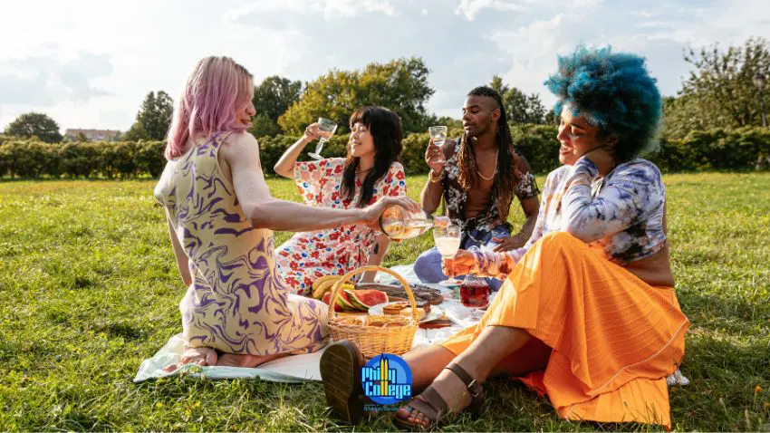 a group of people having a picnic in the park