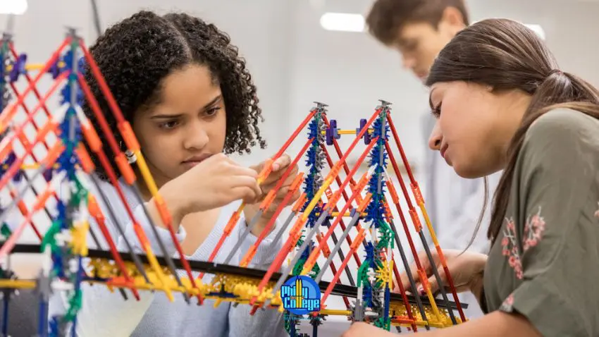 two girls working on a project in a classroom