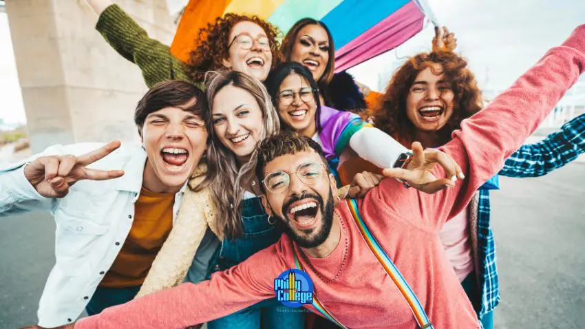 a group of people with rainbow flags in the air