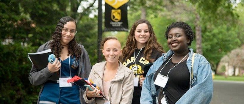 Students smiling outside of Cedar Crest College