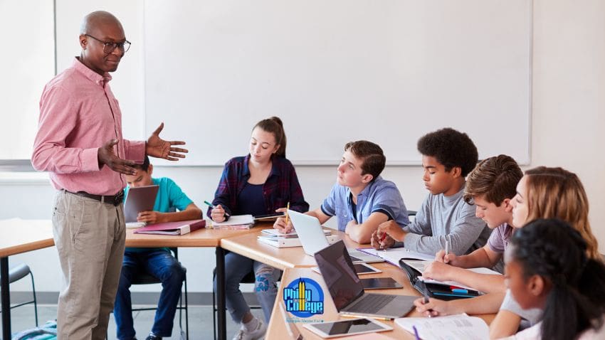Teacher lecturing to a handful of students