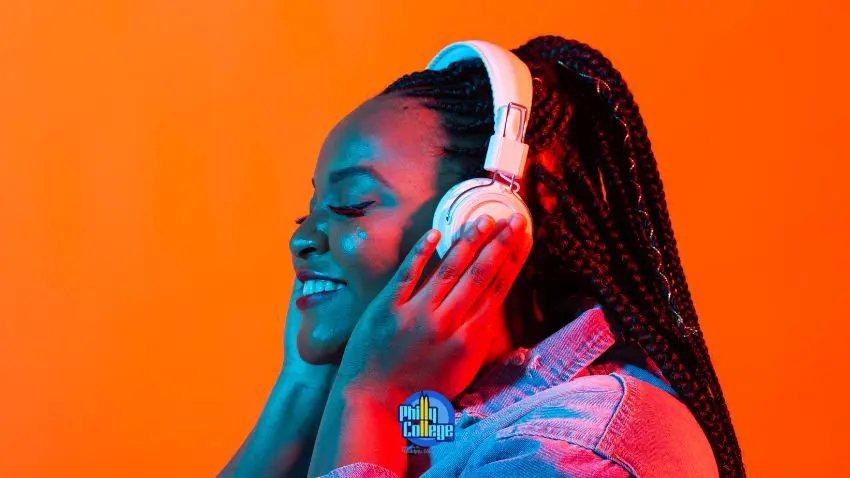 A woman listening to music on headphones