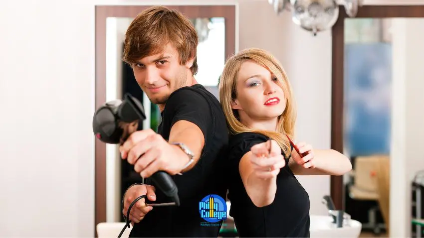 Two people in front of a mirror with hair dryers.