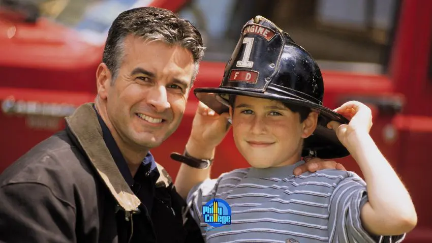Two people are posing for a photo in front of a fire truck