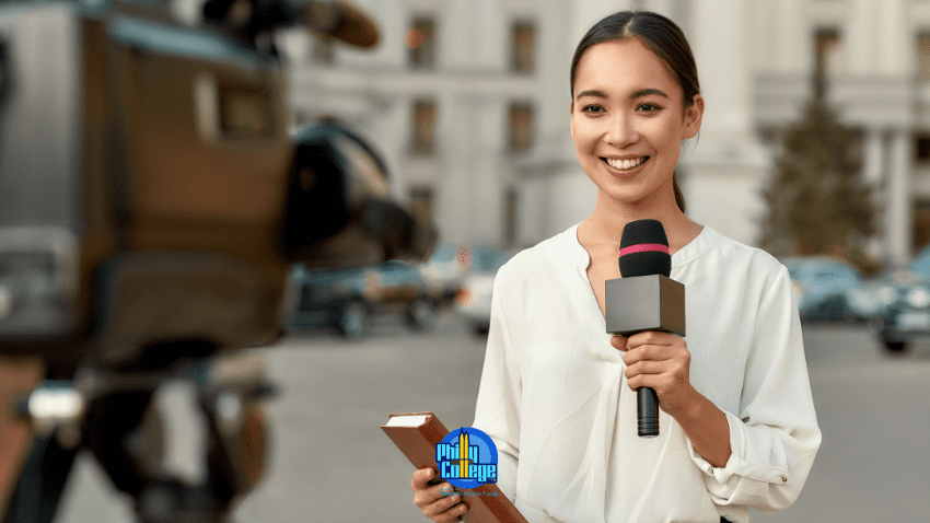 young journalist holding mic in front of camera
