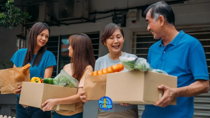 A group of people holding boxes of food