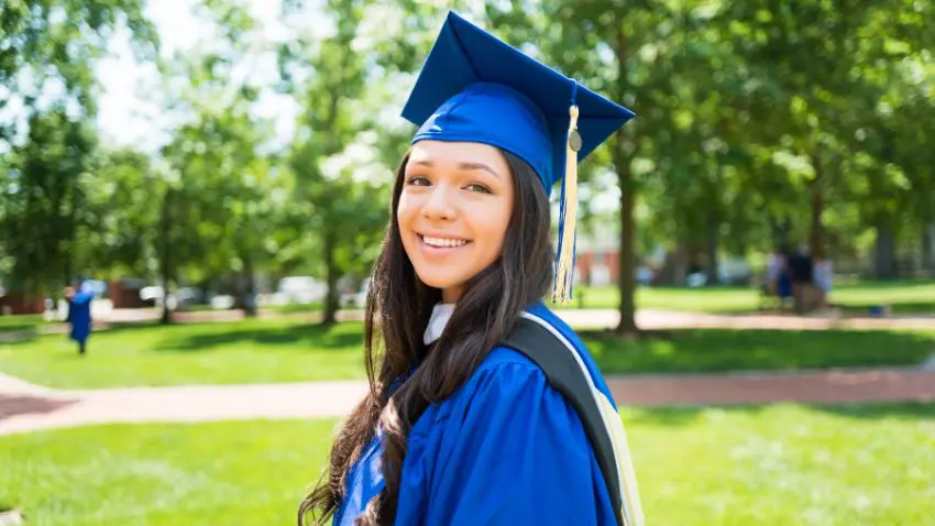 A person wearing a graduation cap and gown