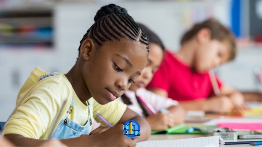 a group of children are sitting at desks and writing