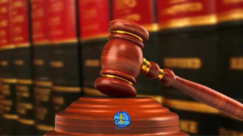 judge's gavel in front of a stack of law books