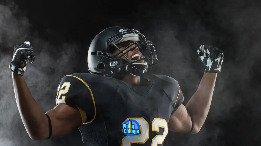 an american football player is celebrating in the smoke