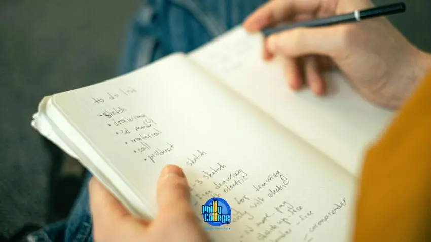 A person writing in a notebook