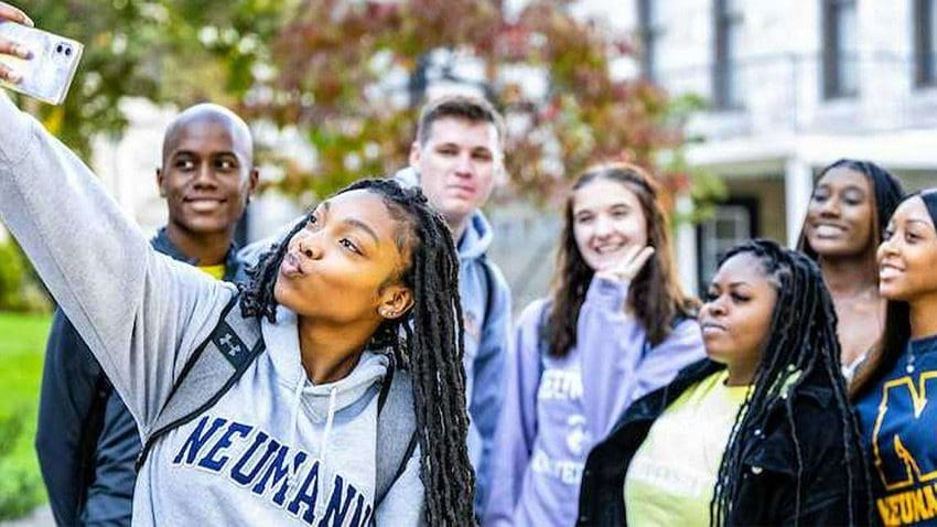 Neuman Students taking group selfie