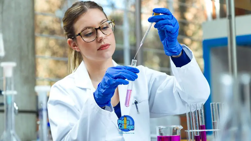 a person in a lab coat is holding a test tube